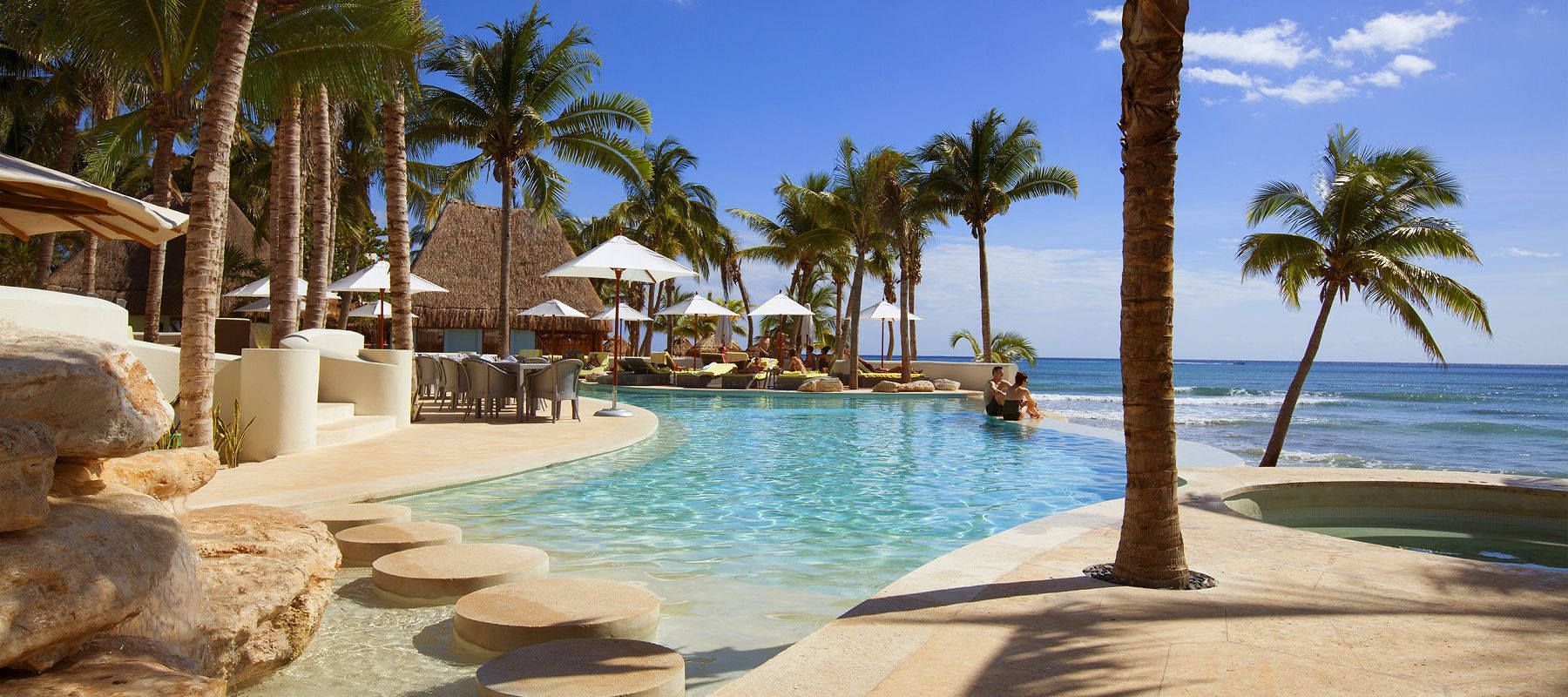 Resort-style infinity pool overlooking the Caribbean at Mahekal Beach Resort